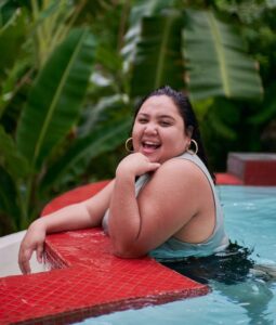 woman in pool smiling